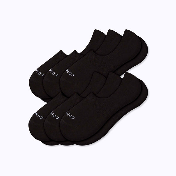 Six black low-cut ankle socks arranged in two overlapping stacks on a light gray background.