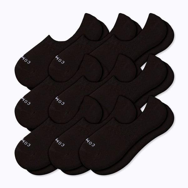 Nine black no-show socks arranged in two overlapping rows on a white background.