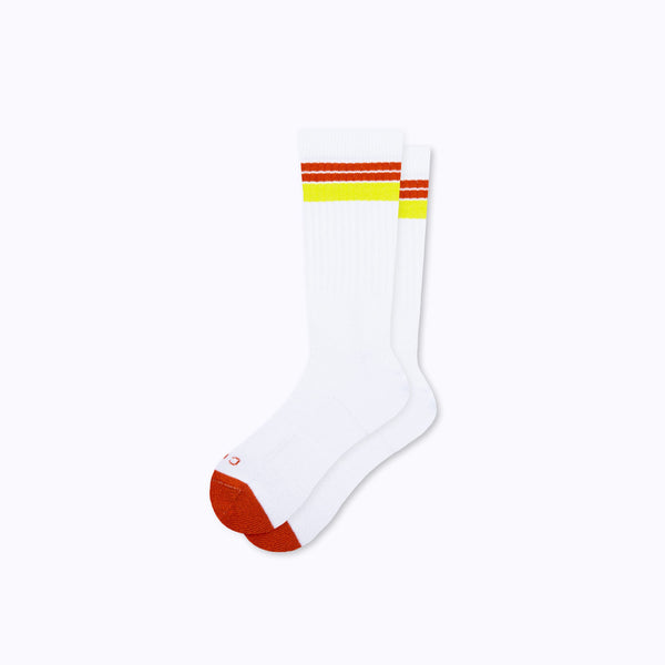 A pair of cotton crew socks in white-cinnamon stripes