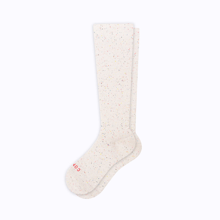 one of our knee-high reycled cotton compression socks with confetti pattern