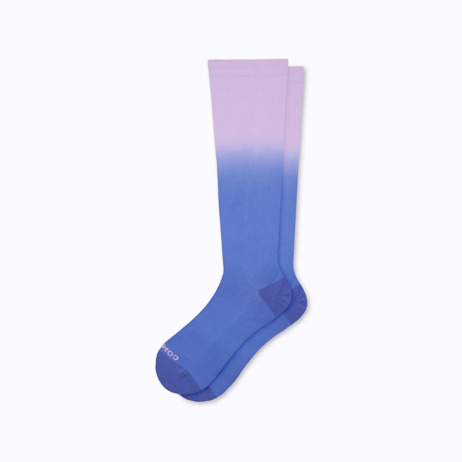 a pair of nylon knee high compression socks in purple denim
