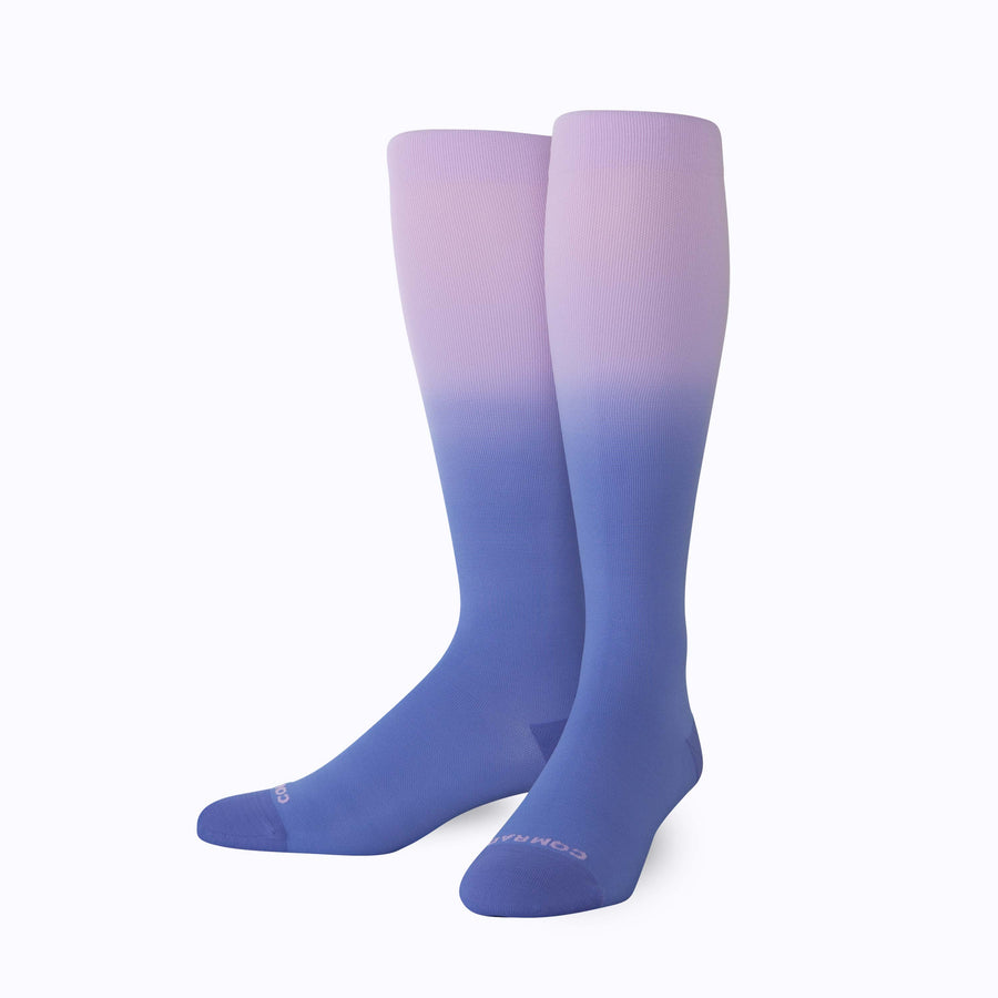 a pair of nylon knee high compression socks in purple denim on mannequin