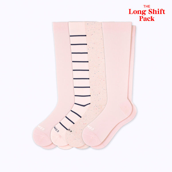 Set of three pairs of pink knee-high socks with different patterns on a white background.