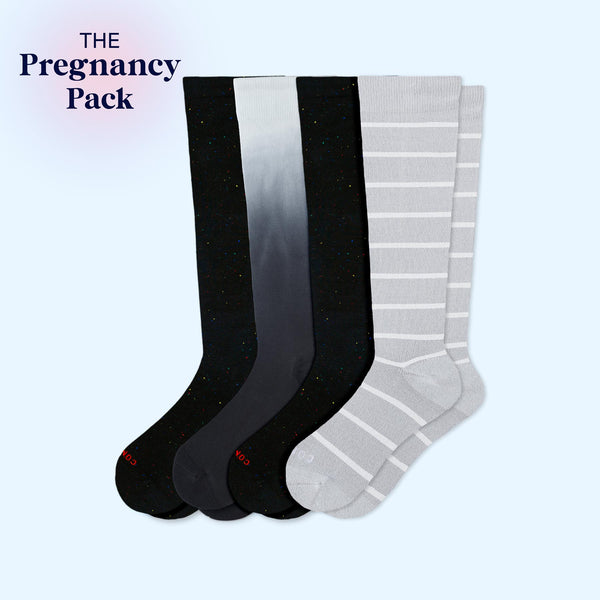 Four compression socks labeled 'The Pregnancy Pack' on a light blue background