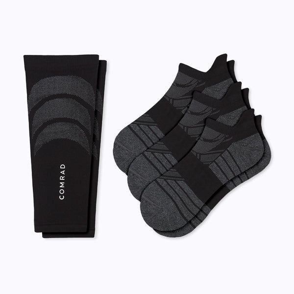 a pair of a black calf sleeve and three pairs of black ankle socks