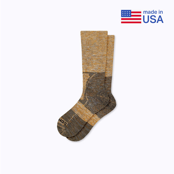 Pair of brown socks with a USA flag and 'made in USA' text on a white background