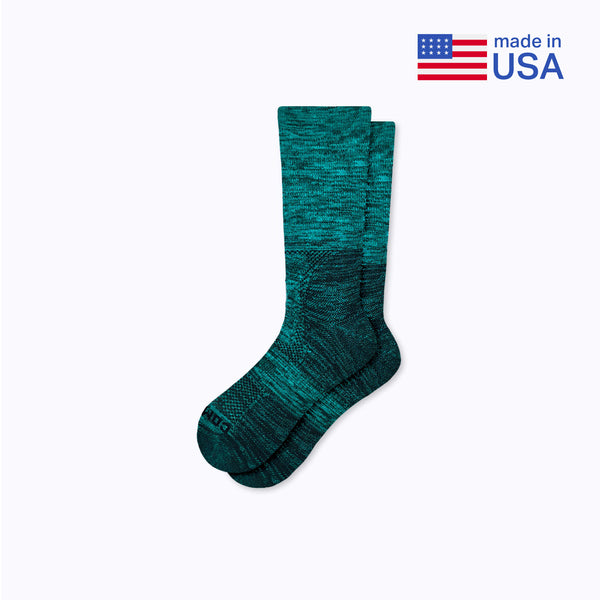 Teal sock on a light gray background with 'Made in USA' label.