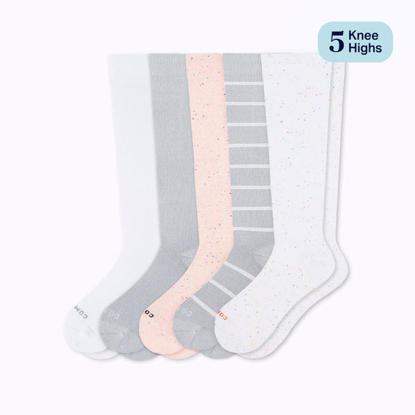 Set of five pairs of knee-high socks in gray, pink, and white on a white background.