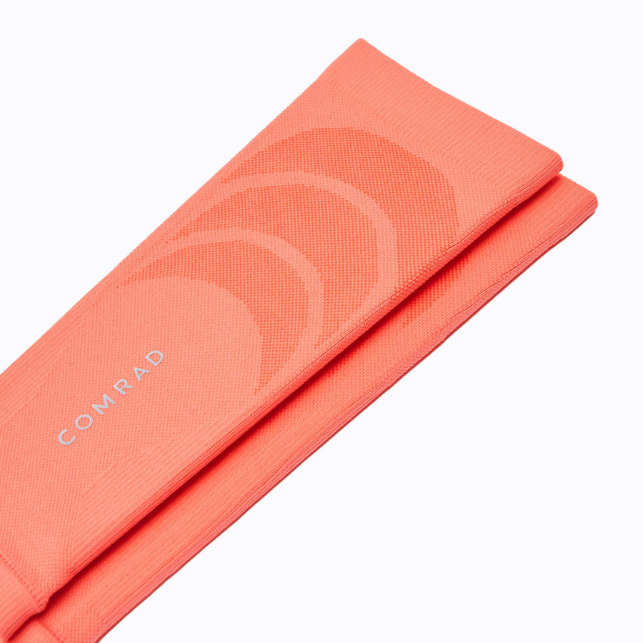 Close up of calf compression sleeve performance blend coral solid