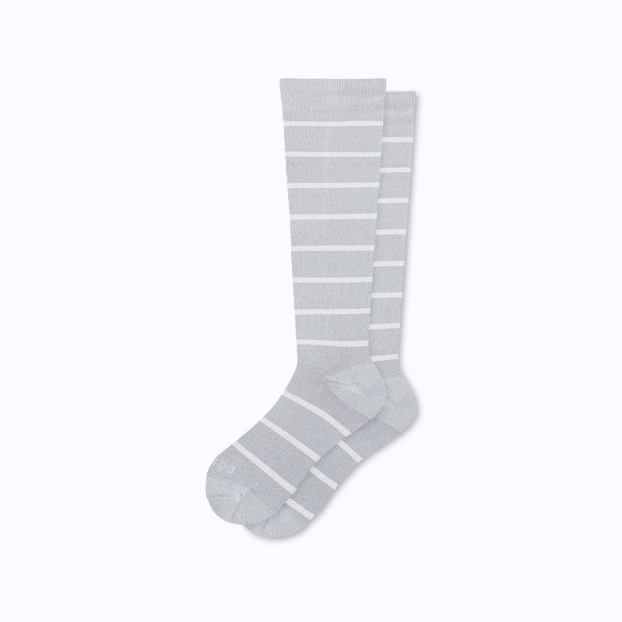 A pair of nylon knee high socks in heather-white stripes