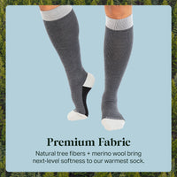 Gray knee-high socks with white accents on a light blue background
