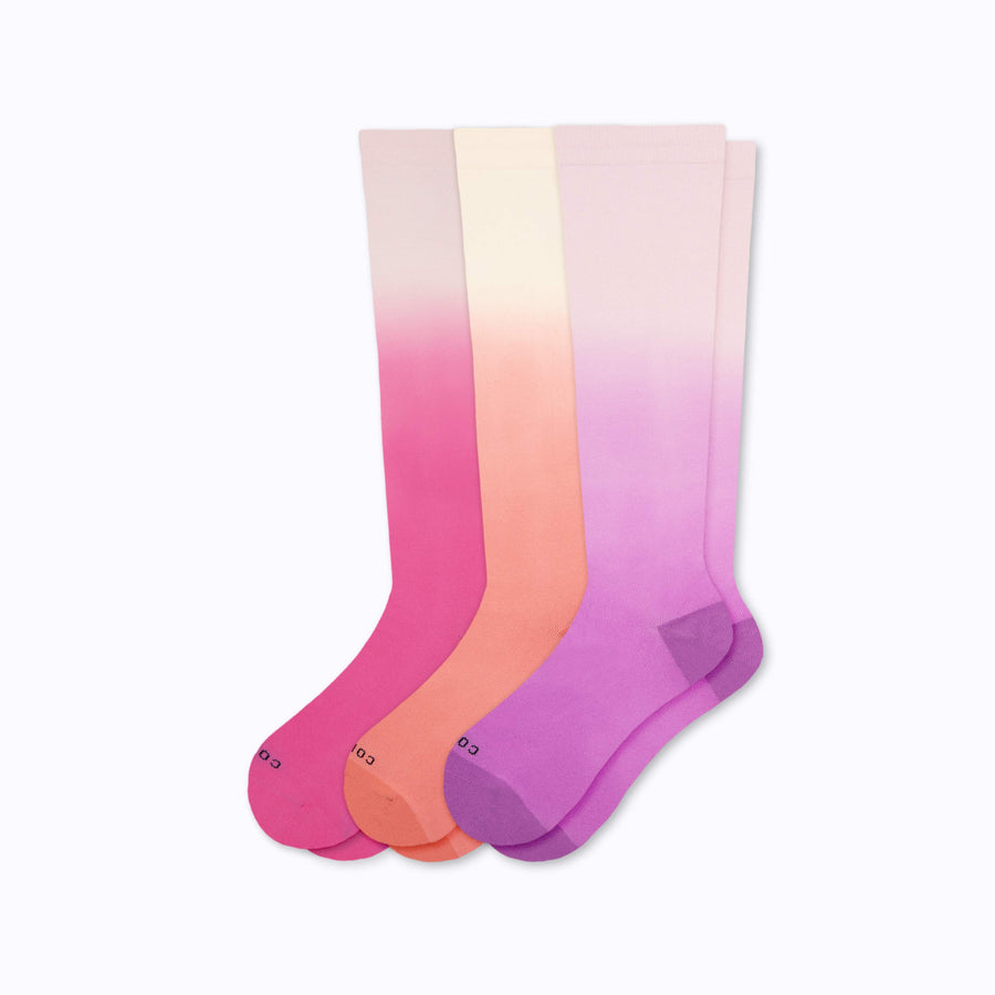 a 3-pack of ombre knee high compression socks in berry, terra cotta, and mulberry