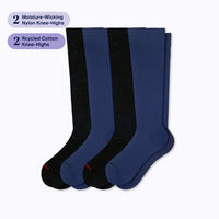 Two pairs of knee-high socks, one galaxy black and one navy blue, on a white background with text about material and design.