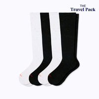 Two pairs of galaxy black and white stargazer  socks labeled 'The Travel Pack' on a white background.