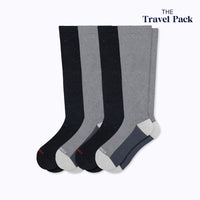 4 pack of knee high compression socks, 2 black recycled cotton and 2 grey cloudcotton. Upper right-hand badge says The Travel Pack