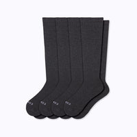 Set of four dark gray socks on a white background