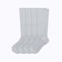 Set of four light gray socks on a white background