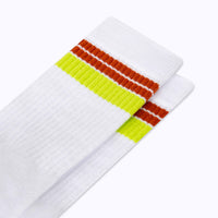 Close up view of cotton crew socks in white-cinnamon stripes