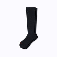 A pair of black knee-high compression socks made from recycled cotton, displayed against a white background.