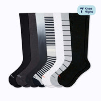 Set of seven pairs of knee-high socks in black, gray, and white with striped patterns on a white background.