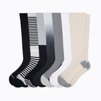 7 pairs of knee-high socks in a mix of solids stripes and speckled. 