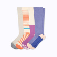 Four pairs of cloudcotton knee-highs on a light grey background