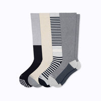 Four pairs of knee-highs in grey and blacks