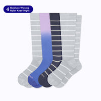 Fours pairs of knee-high socks, two grey with white stripes, one navy with white stripes and one blue/purple ombre on a light grey background with a banner saying "4 moisture-wicking nylon knee-highs"