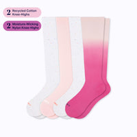 Set of four knee-high socks in white, pink, and ombre design on a white background.