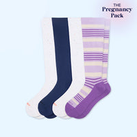 Set of four pairs of knee-high socks in white, navy, and purple with striped pattern on a light blue background.