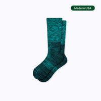 Teal sock on a light gray background with 'Made in USA' label.