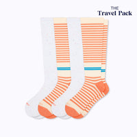 A travel pack of 2 pairs of knee-high socks with cream/terracotta stripes and stargazer colors