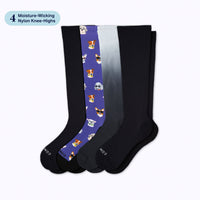 Set of four knee-high socks with different patterns on a white background