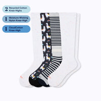 Three pairs of knee-high socks with labels indicating types and materials on a white background.