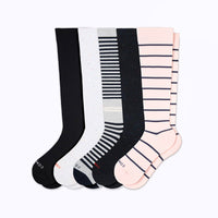 Set of five pairs of knee-high socks in black, white, gray, and pink with striped pattern on a white background.