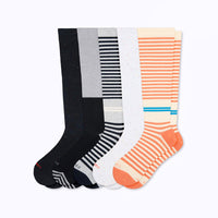 Set of five knee-high socks in black, gray, white, and orange with striped patterns on a white background.