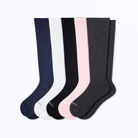 Set of five pairs of knee-high socks in navy, white, black, pink, and gray on a white background.