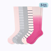 Set of five pairs of knee-high socks in pink, gray, and striped patterns on a white background.