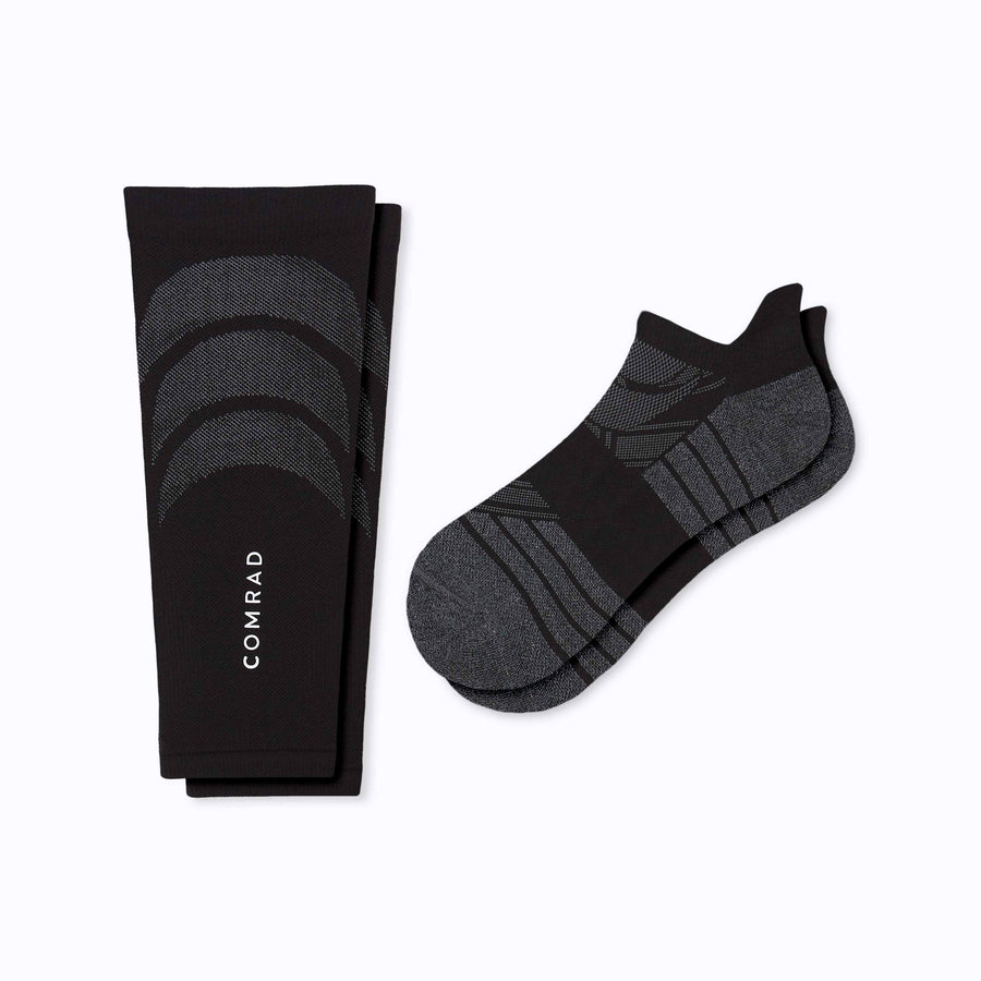 A 2 pack of tab athletic socks and calf sleeve compression black solid