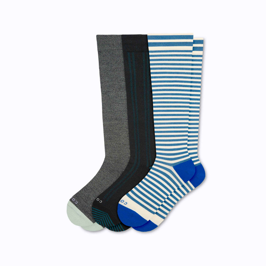A 3-pack of knee high compression socks in black-blue-sage