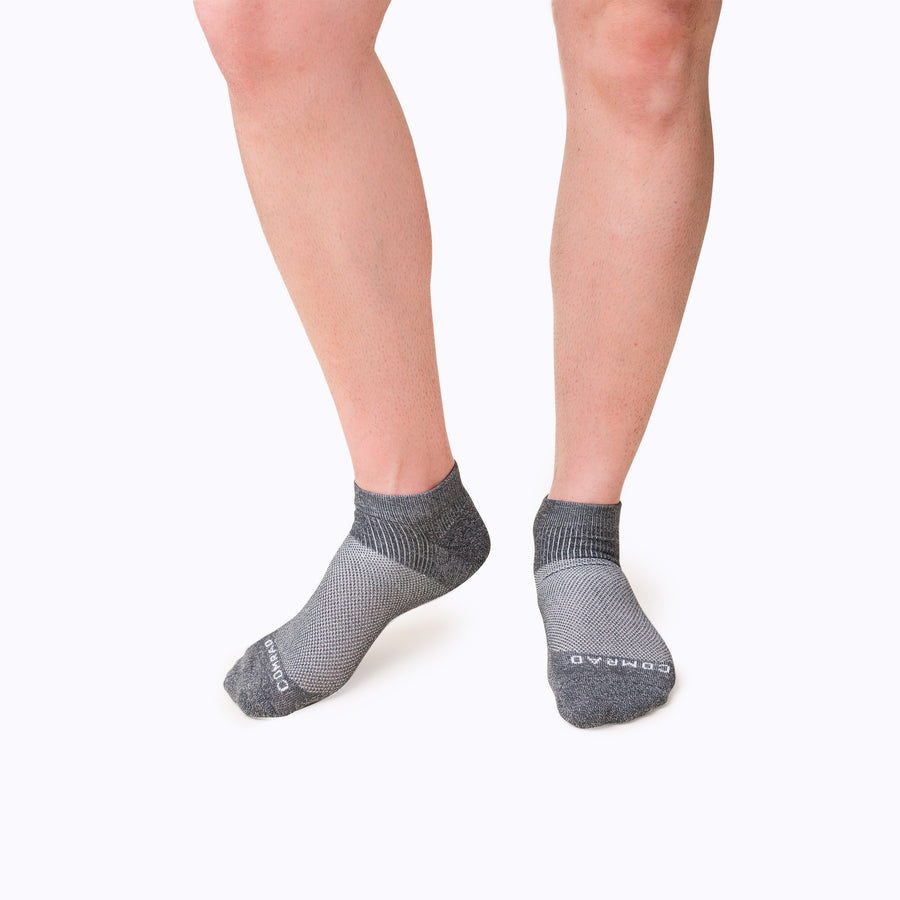 Front view of feet wearing nylon ankle socks in charcoal solid