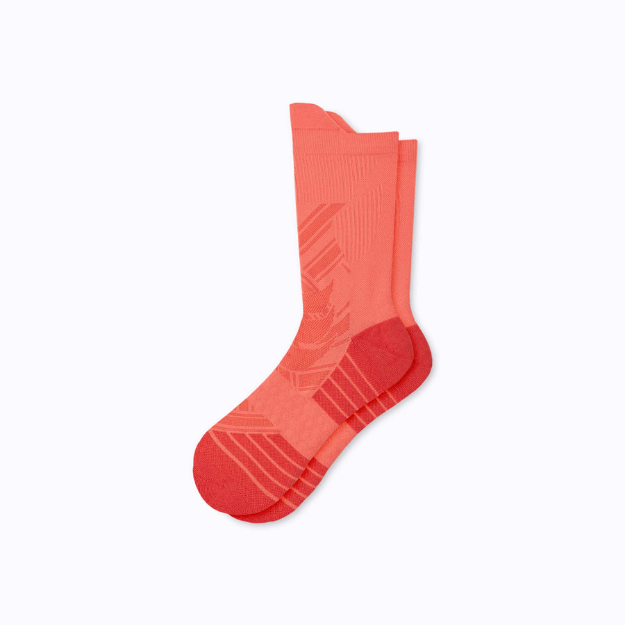 A pair of an athletic crew compression socks coral solid