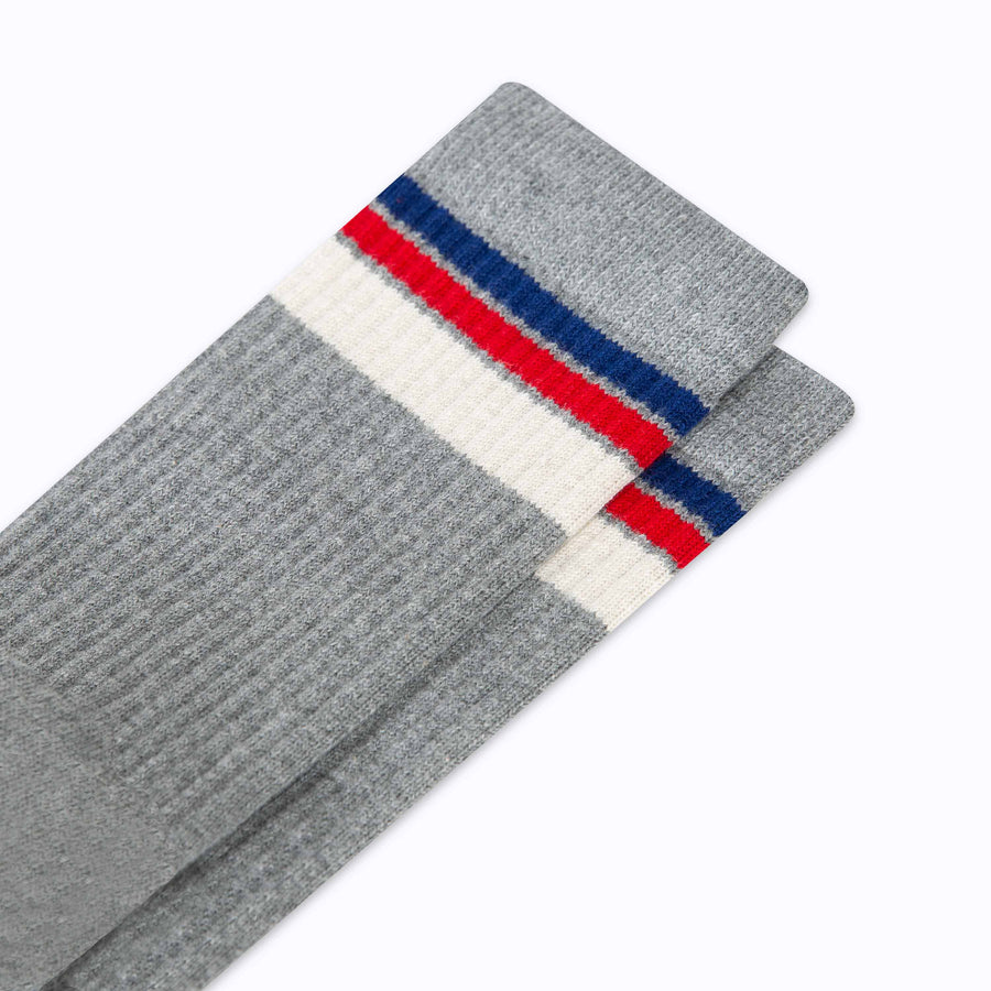 Close up view of cotton crew socks in grey-navy stripes