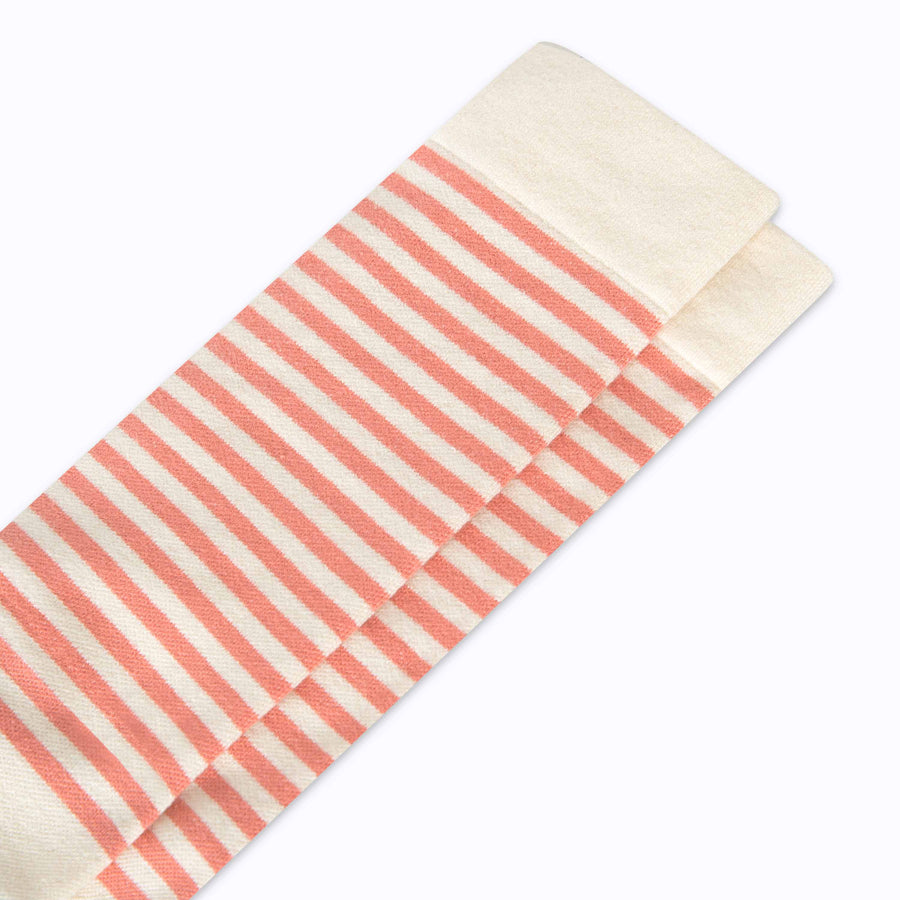 Close up view of cotton compression socks in cream-terra-cotta tencel stripe
