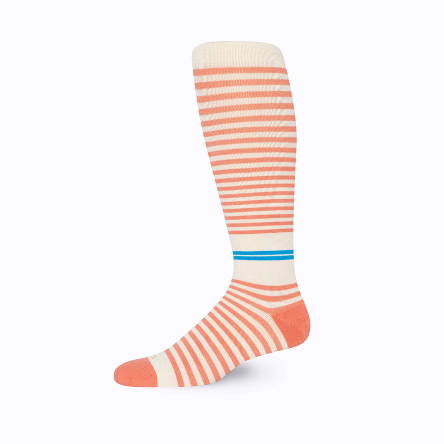 Side view of cotton compression socks in cream-terra-cotta tencel stripe