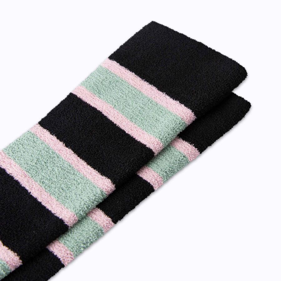 Close up view of cozy nylon compression socks in black-green