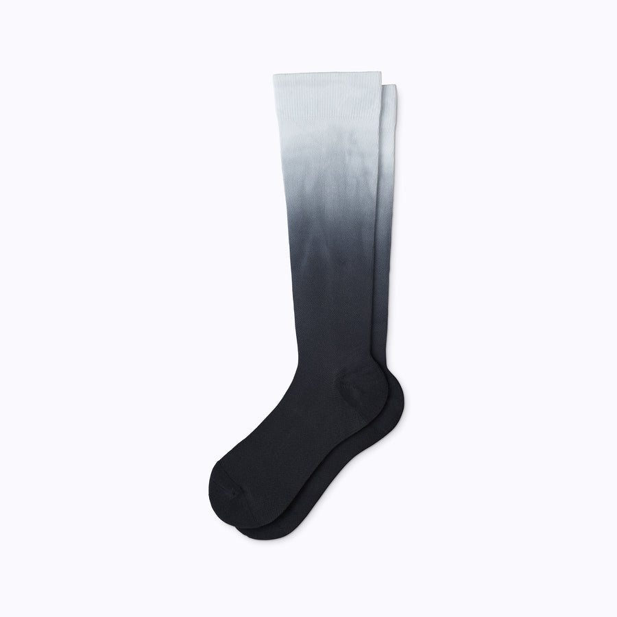 A pair of nylon knee high socks compression in black ombre