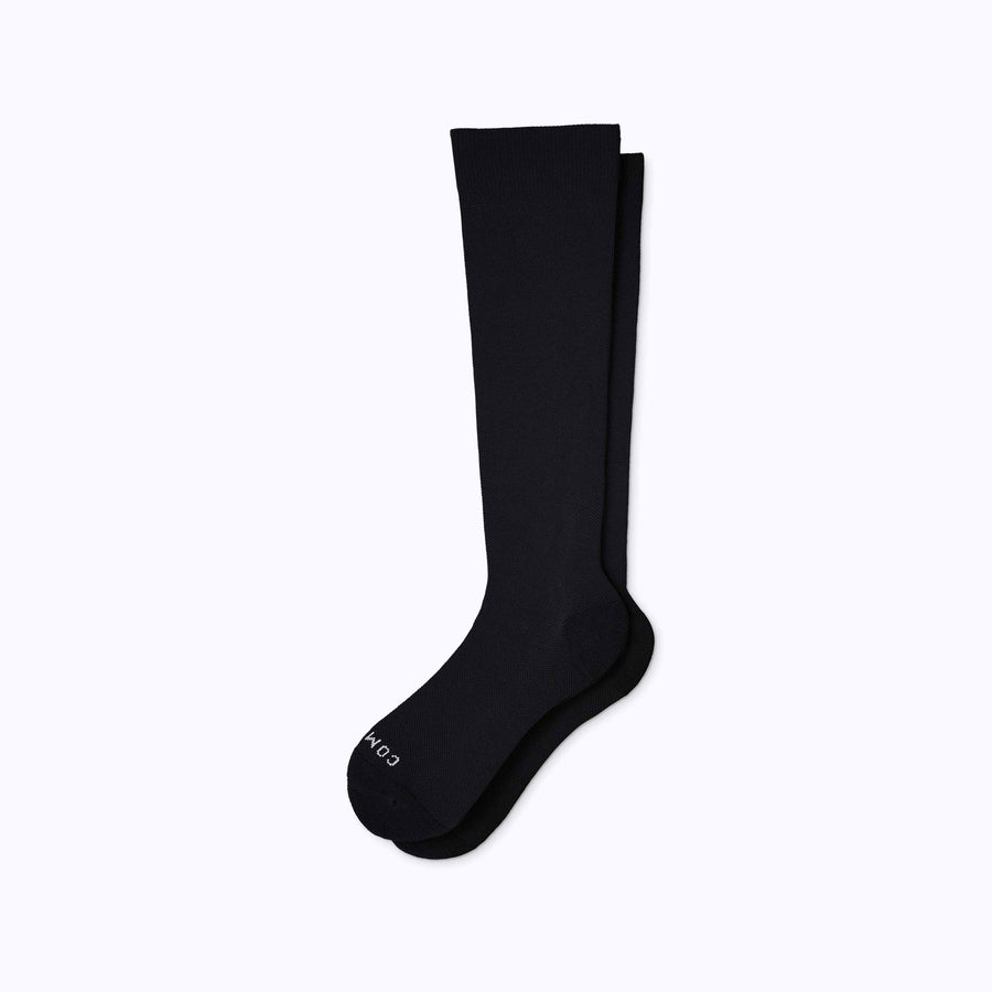 A pair of nylon knee high socks compression in black solid