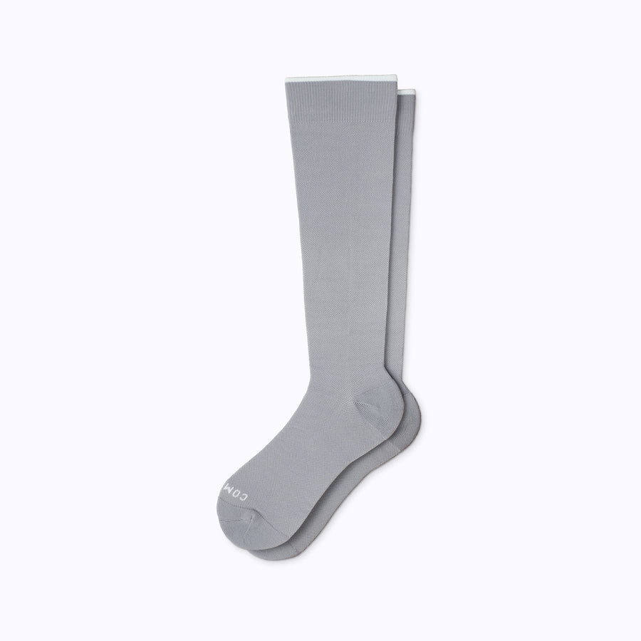 A pair of nylon knee high compression socks in grey solid