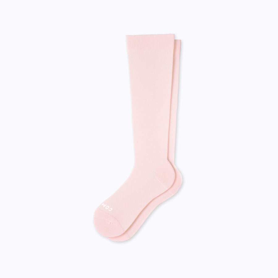 A pair of nylon knee high compression socks in rose solid